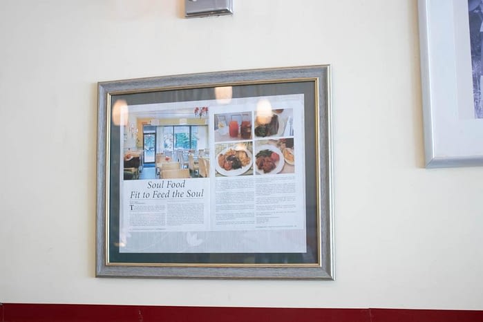 Print article framed on the wall of Miss Mamie's Spoonbread Too in Harlem
