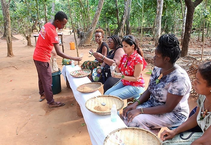 Sucheta Rawal, Grace Odogbili and Go Eat Give travelers on the Jumbo Spice Farm in Tanzania