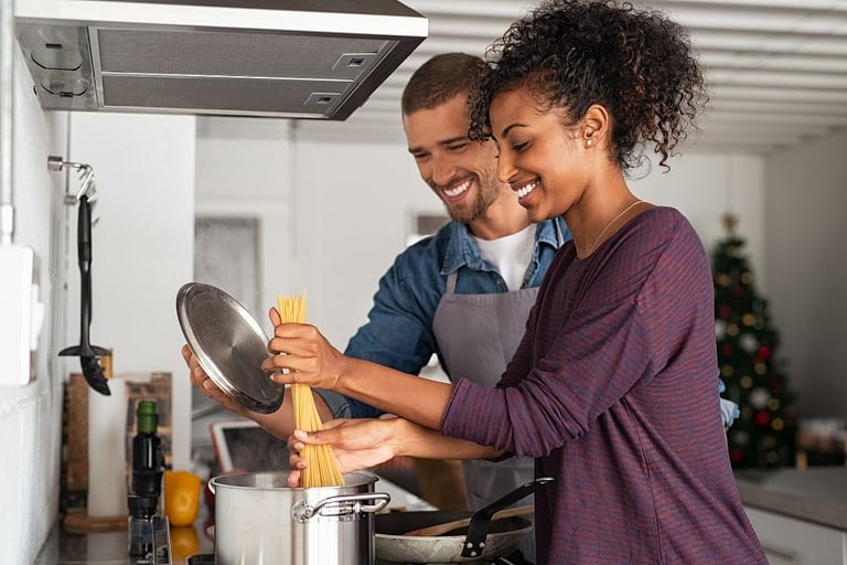 Couple cooking with filtered water